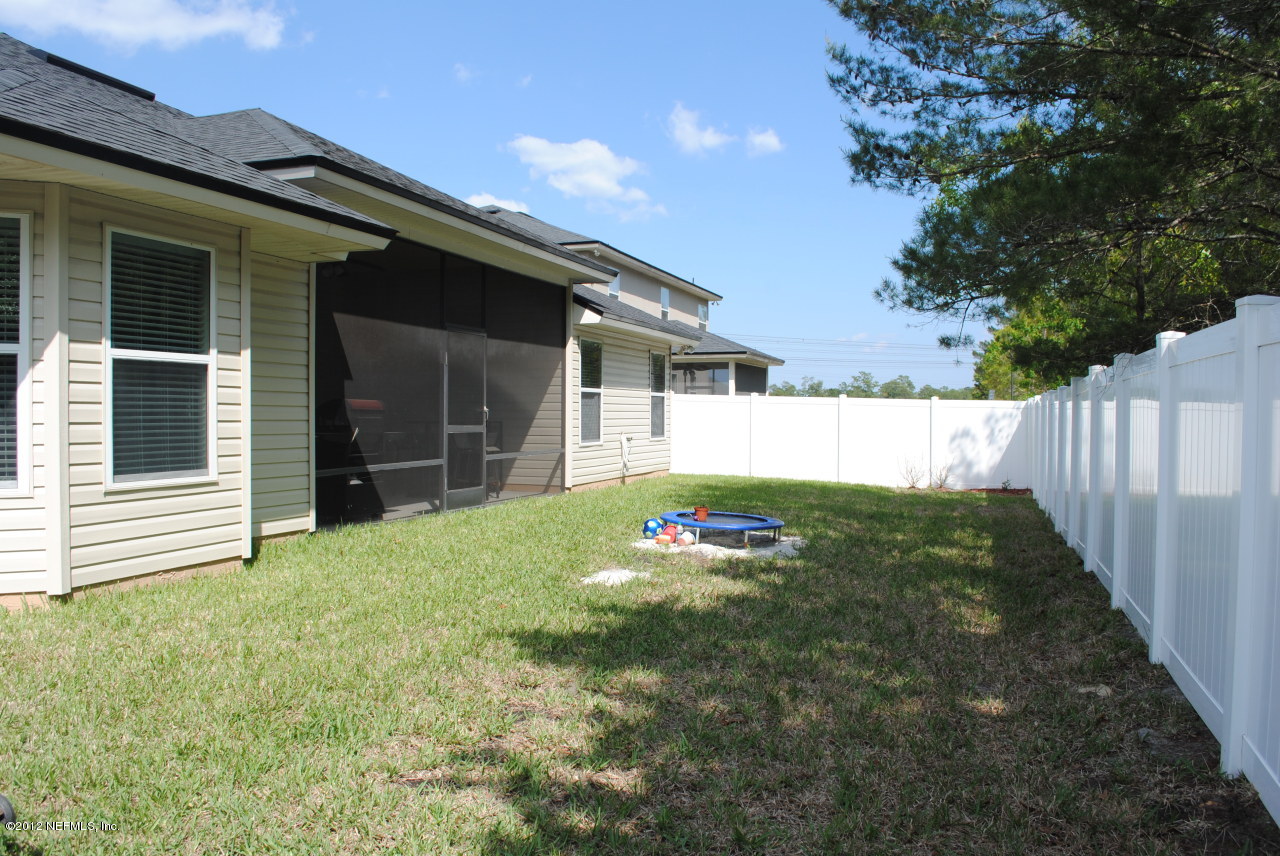 4062 Trail Ridge Road Middleburg, FL 32068 - Photo 28 of 28 Backyard and White Vinyl Fence