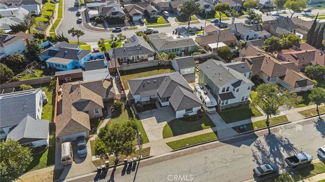 an aerial view of a houses with yard