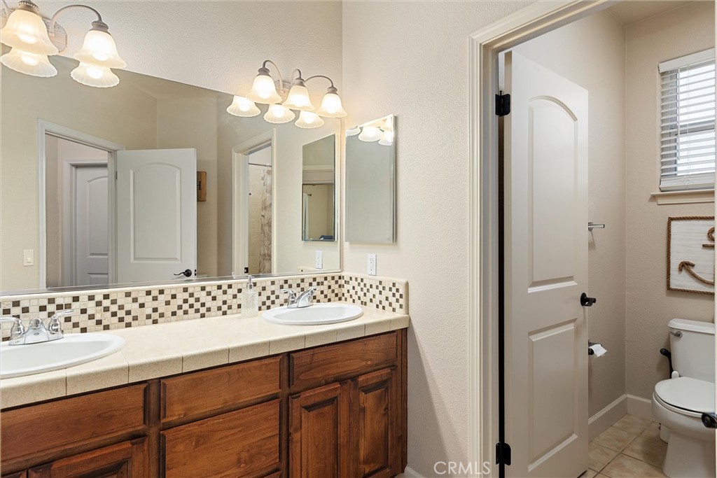 204 Vista Del Rio Court Paso Robles, CA 93446 - Photo 23 of 43 The guest bathroom upstairs has a separate double vanity area from the shower room.