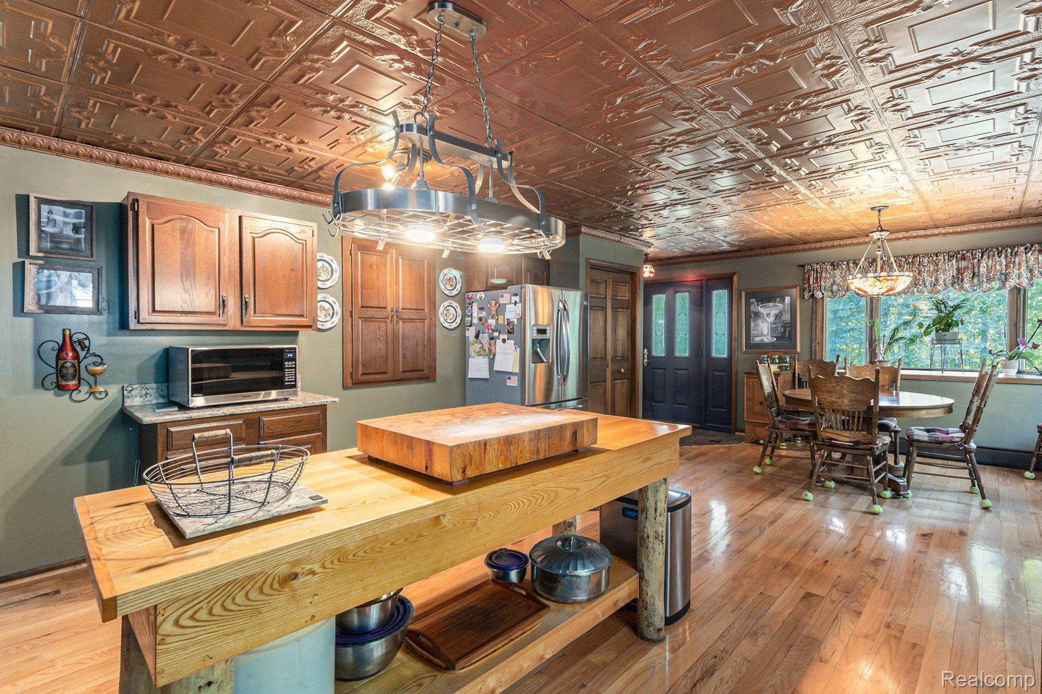 7280 Groveland Road Holly, MI 48442 - Photo 5 of 48 butcher block island and extra cupboard space