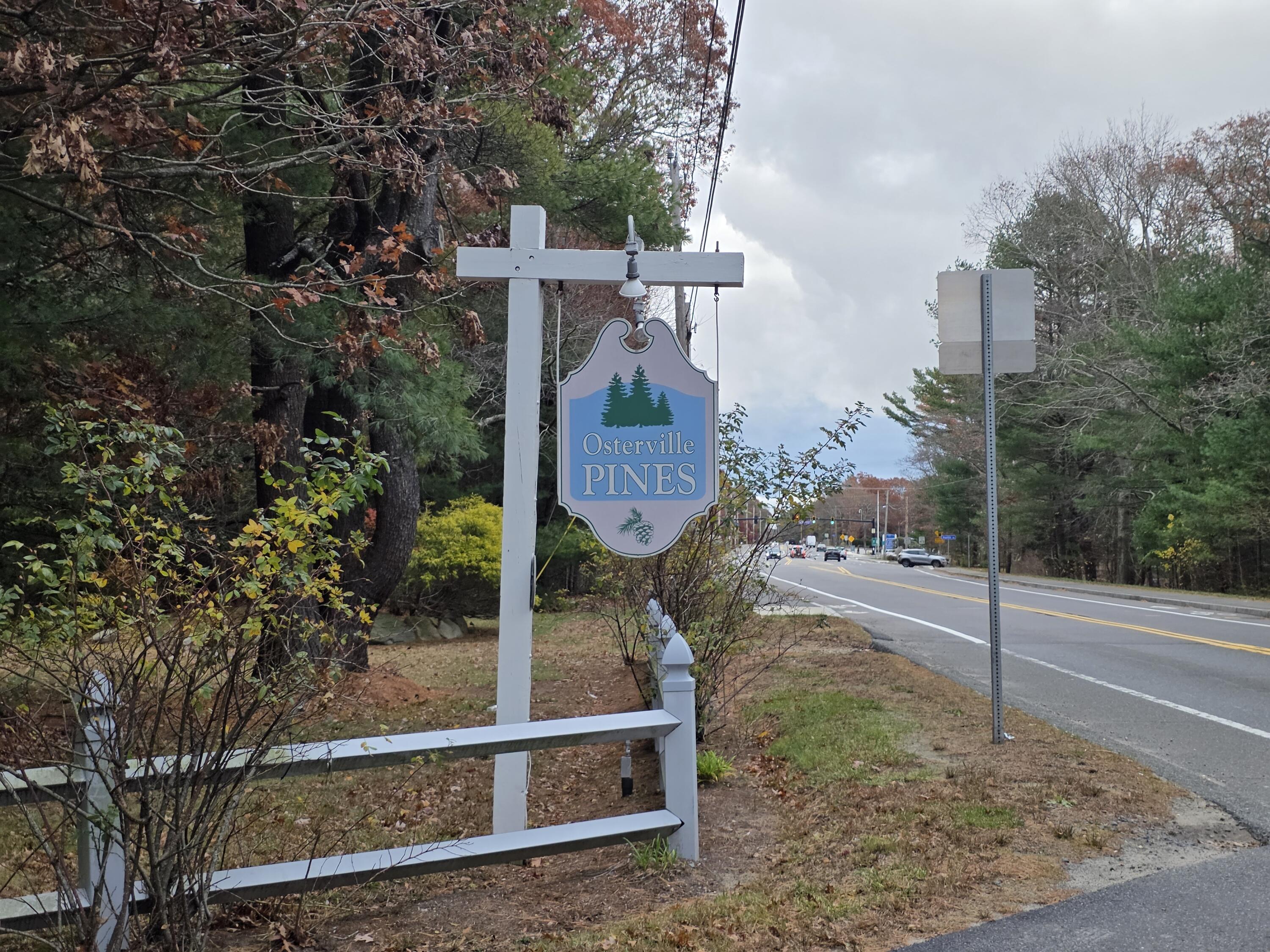3040 Falmouth Road, Unit F3 Osterville, MA 02655 - Photo 14 of 14 a view of a street with large trees