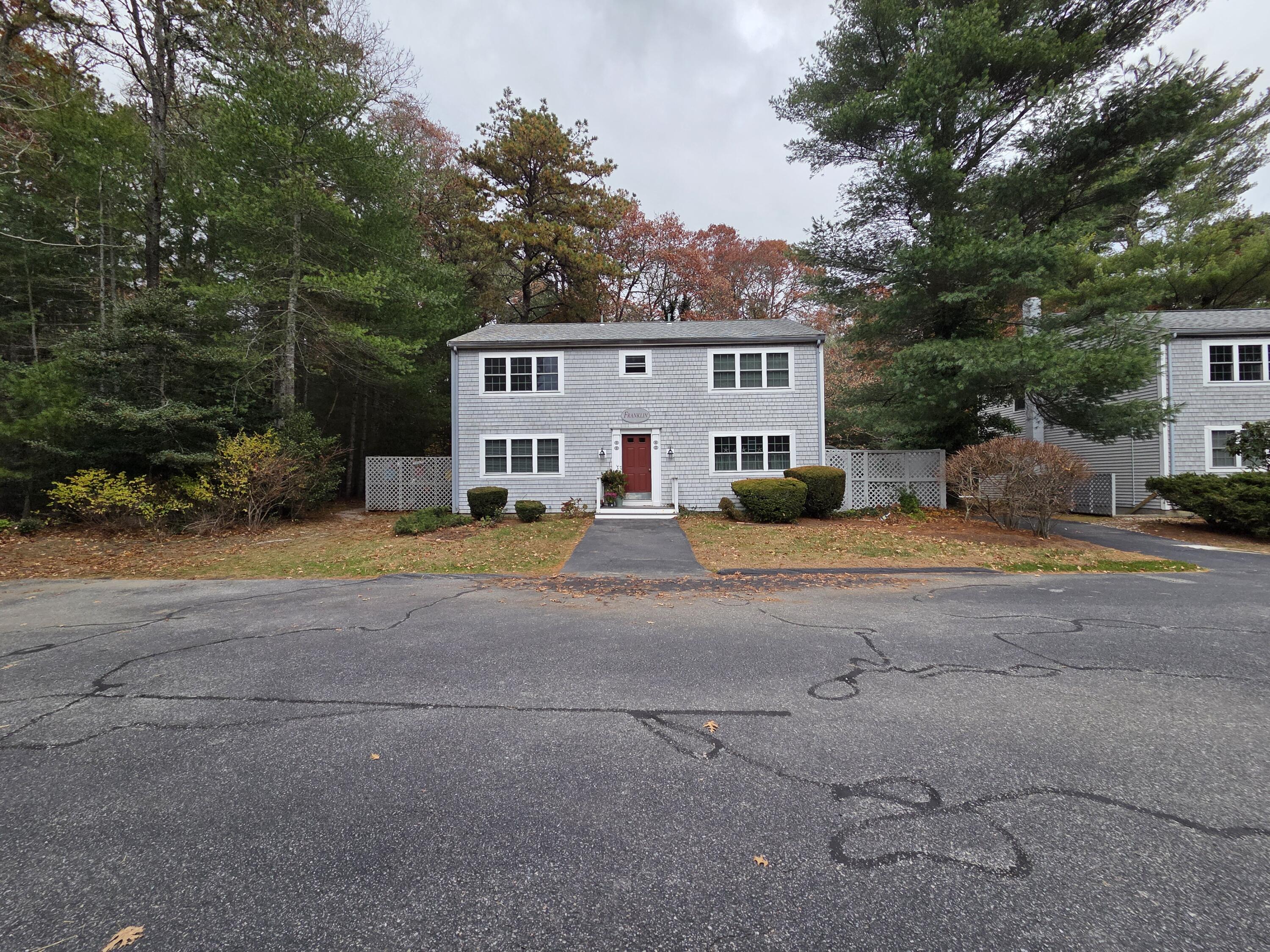 3040 Falmouth Road, Unit F3 Osterville, MA 02655 - Photo 2 of 14 a view of a house with a street