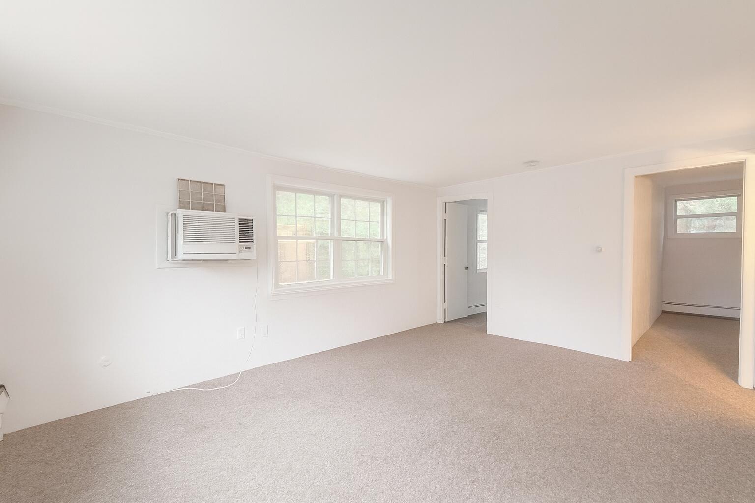 3040 Falmouth Road, Unit F3 Osterville, MA 02655 - Photo 5 of 14 an empty room with windows