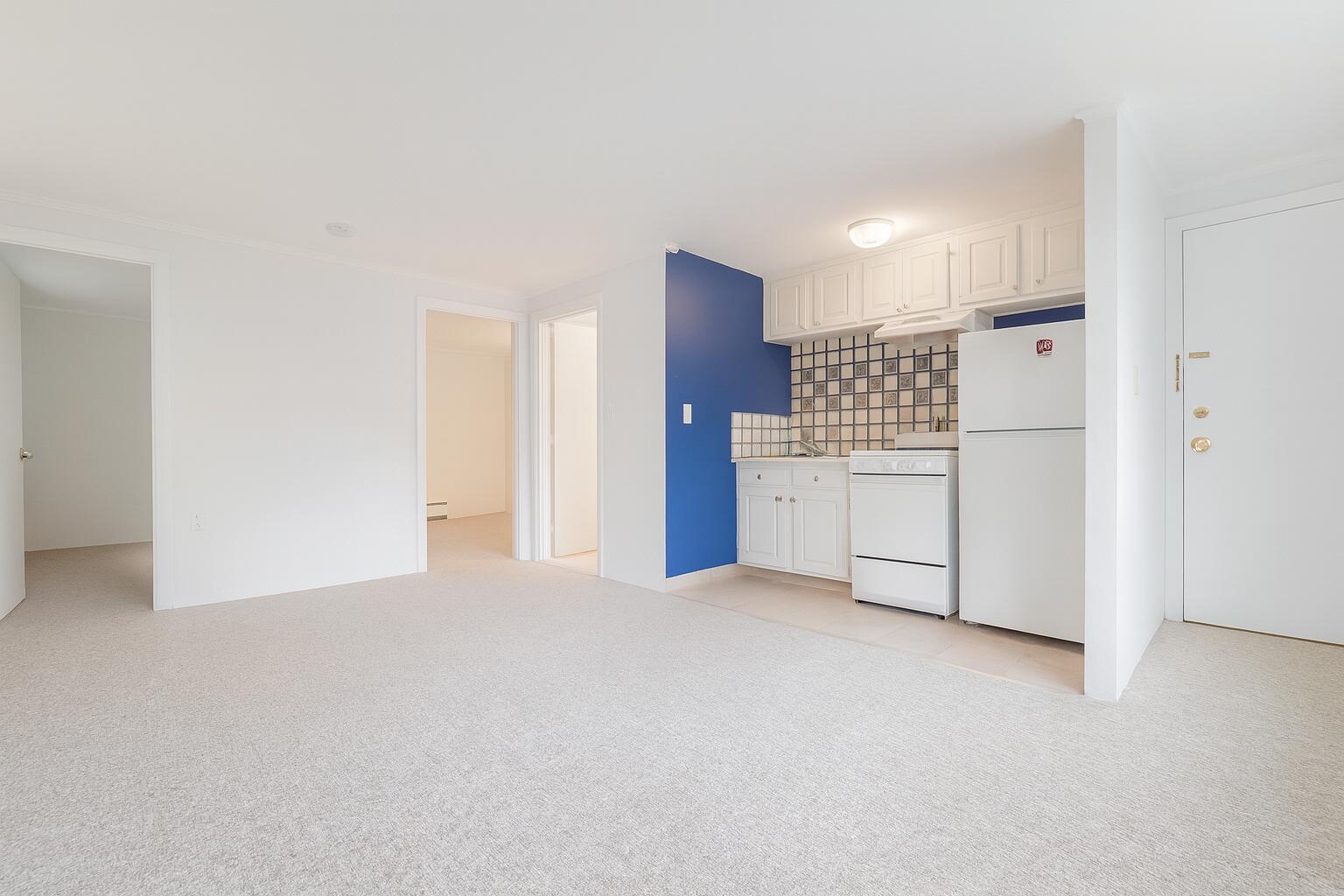 3040 Falmouth Road, Unit F3 Osterville, MA 02655 - Photo 6 of 14 a view of a kitchen with a refrigerator wooden cabinets and a refrigerator