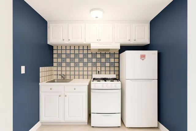 an empty room with windows and cabinet