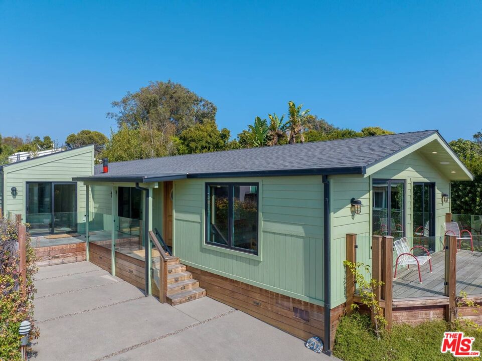 249 Paradise Cove Road Malibu, CA 90265 - Photo 2 of 41 a view of a house with a backyard and porch