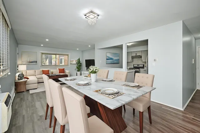 a kitchen with stainless steel appliances granite countertop a refrigerator and a stove