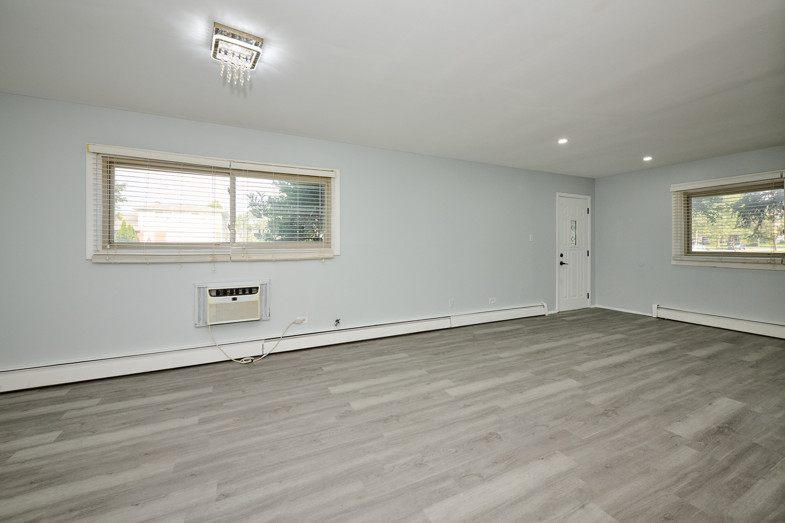 1320 Lore Lane, Unit 101A Lombard, IL 60148 - Photo 18 of 65 an empty room with wooden floor and windows