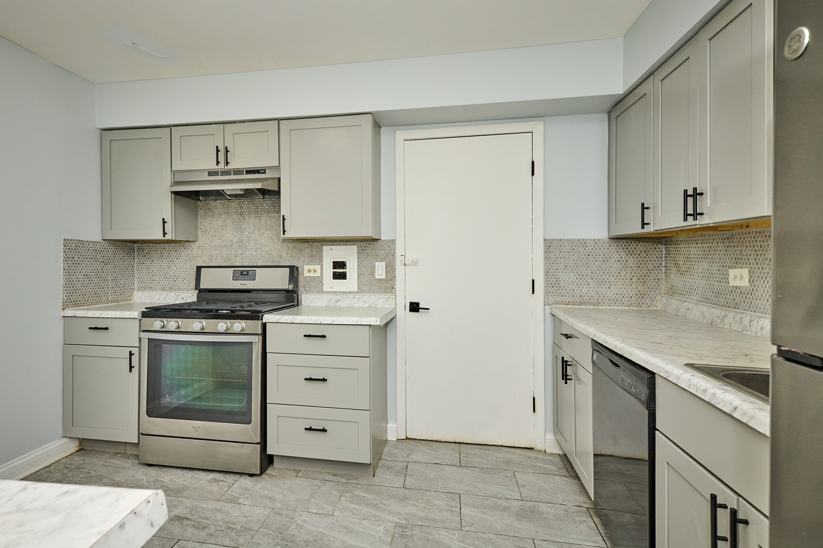 1320 Lore Lane, Unit 101A Lombard, IL 60148 - Photo 20 of 65 a kitchen with stainless steel appliances granite countertop a sink and a stove