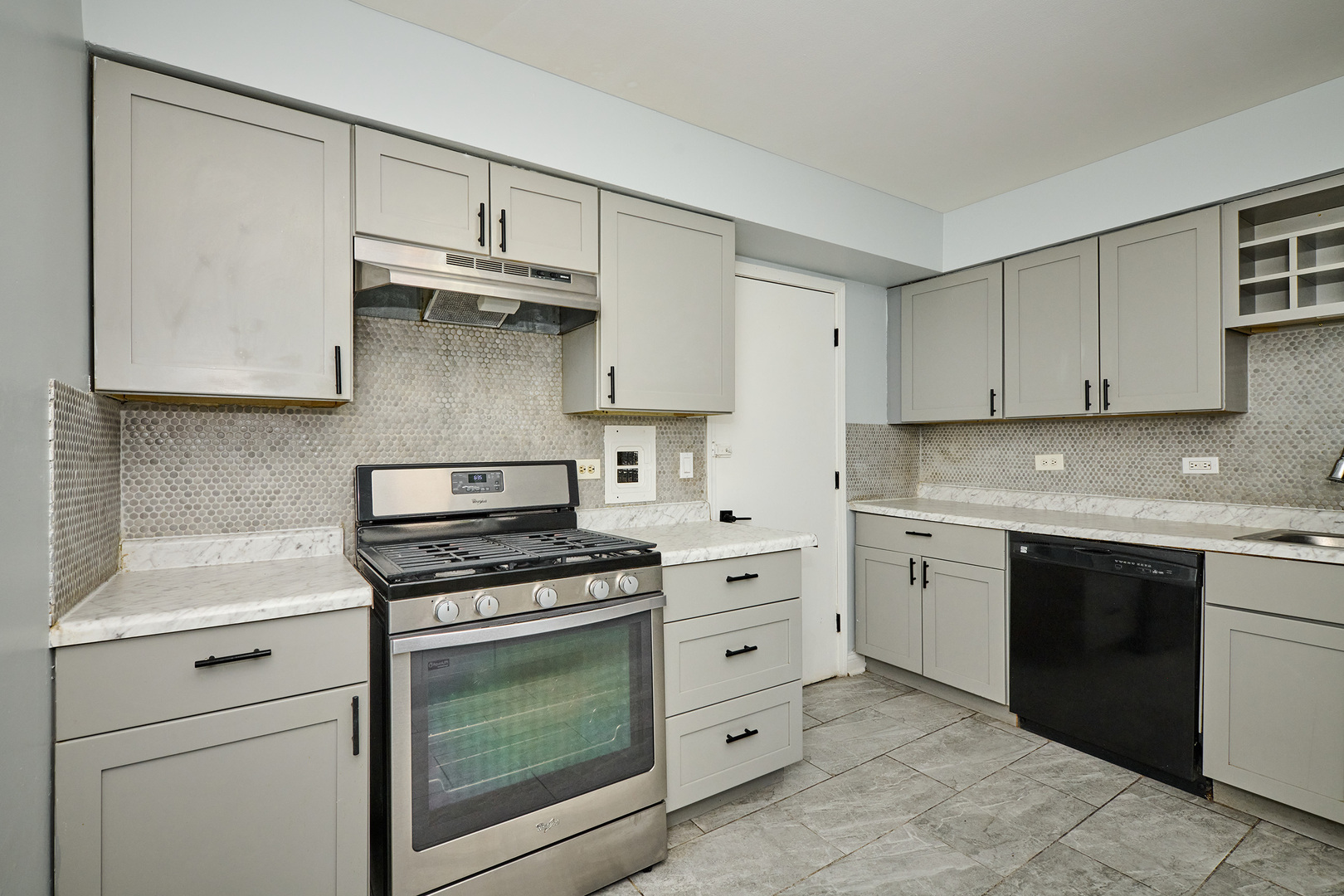 1320 Lore Lane, Unit 101A Lombard, IL 60148 - Photo 21 of 65 a kitchen with granite countertop white cabinets and stainless steel appliances