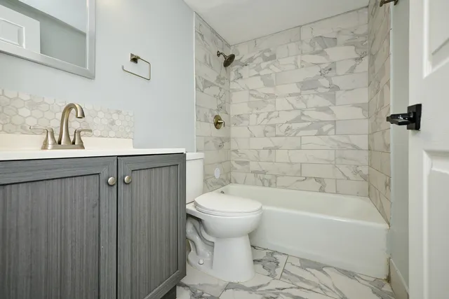 a bedroom with a bed and a table