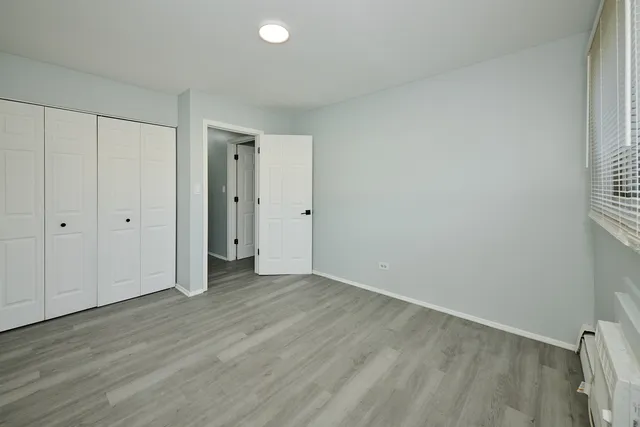 a bathroom with a sink mirror vanity and toilet