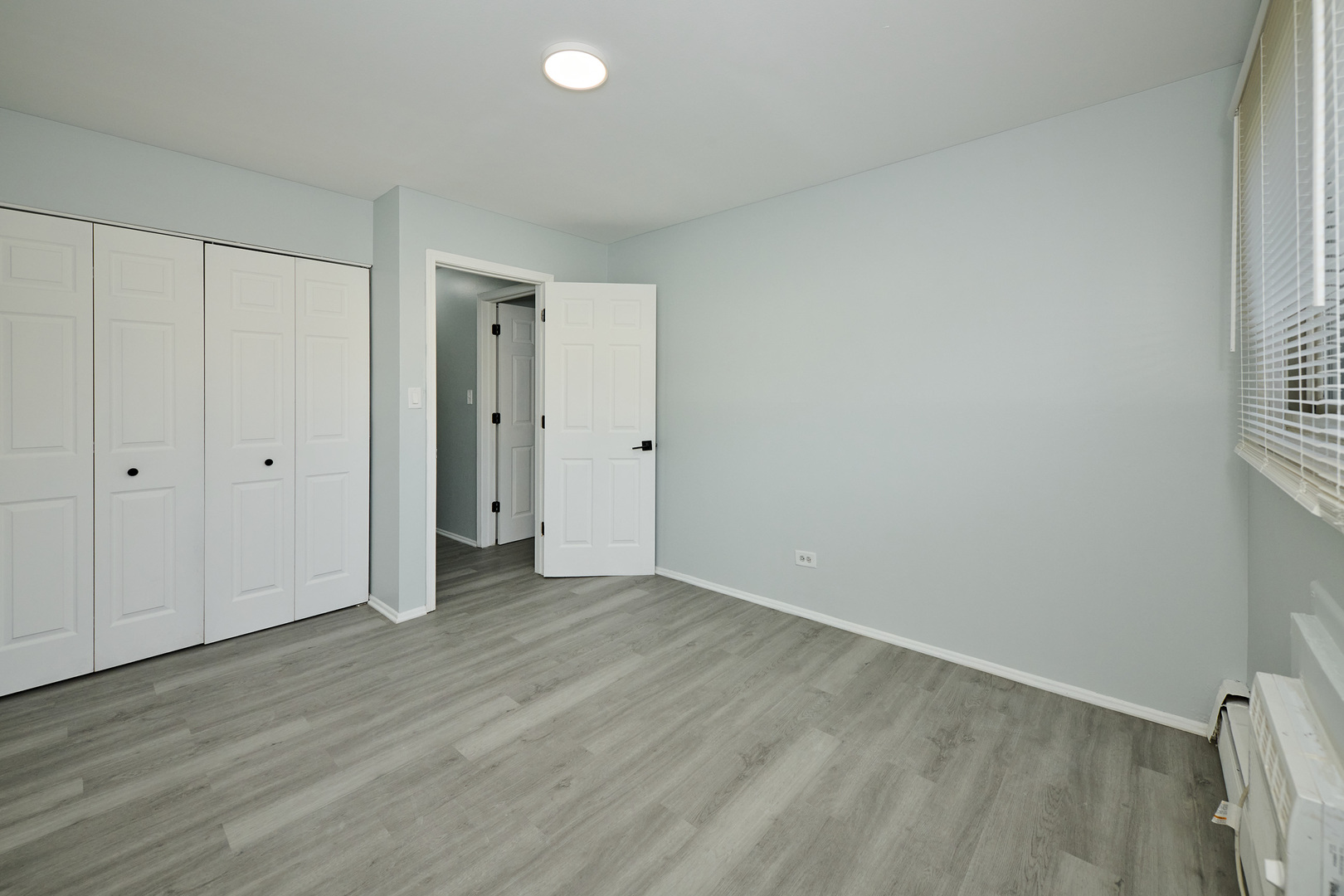 1320 Lore Lane, Unit 101A Lombard, IL 60148 - Photo 39 of 65 a view of an empty room with wooden floor