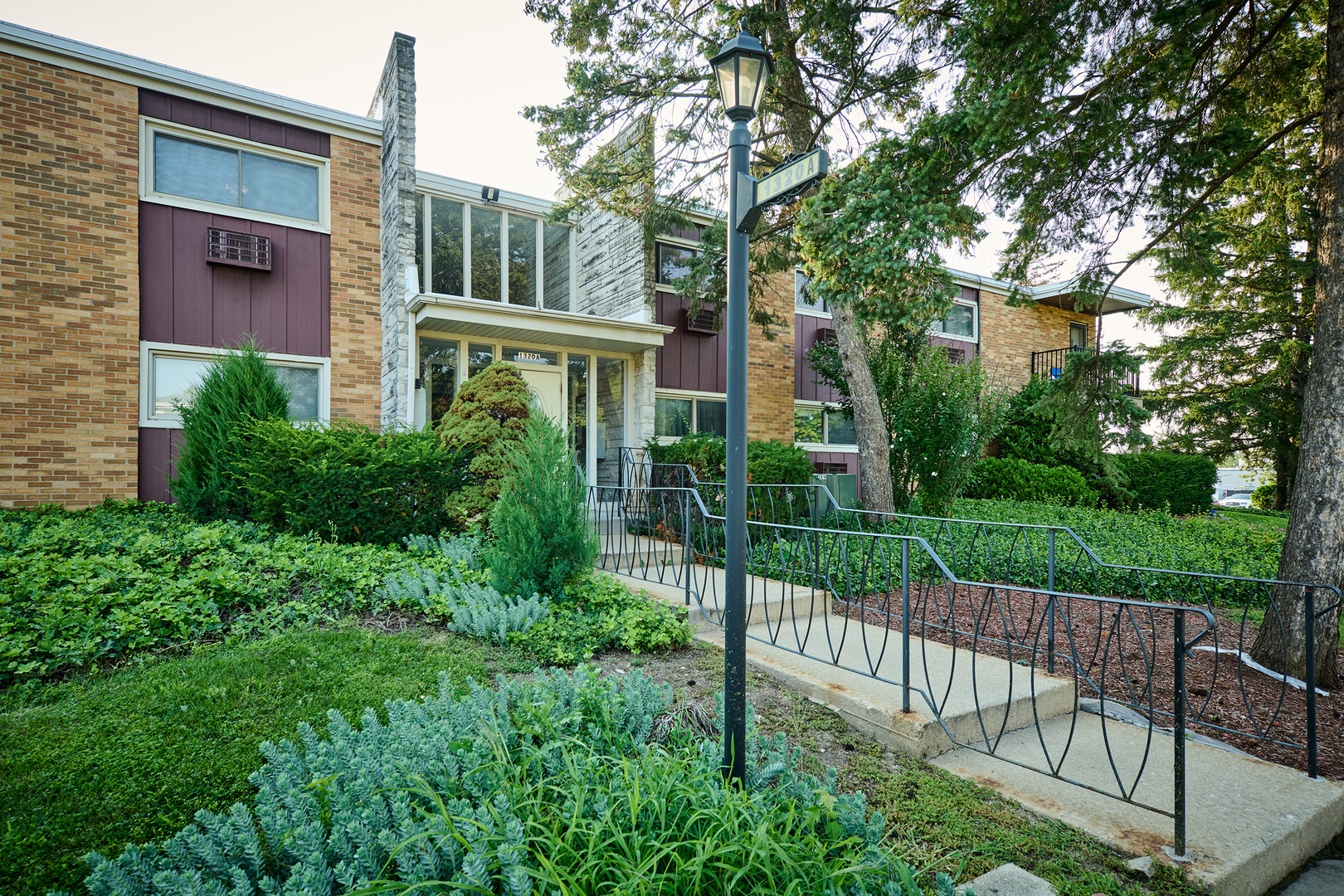 1320 Lore Lane, Unit 101A Lombard, IL 60148 - Photo 56 of 65 a view of a wrought iron fences in front of house