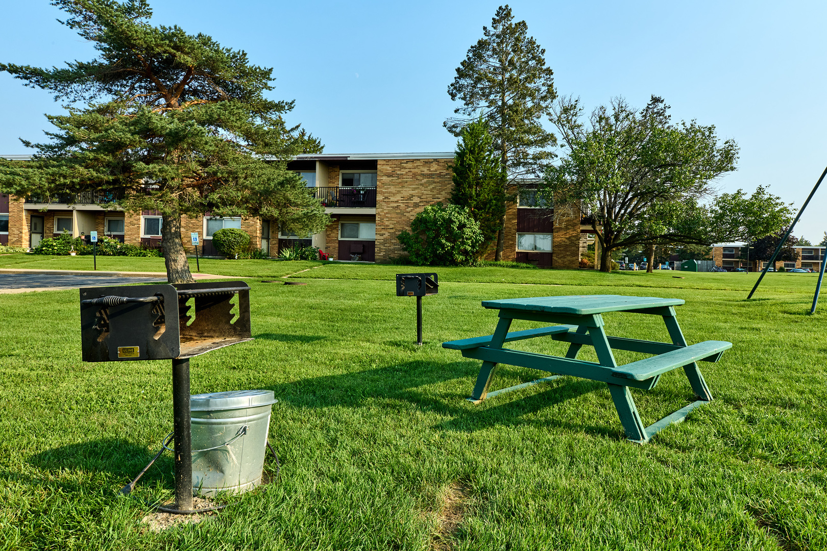 1320 Lore Lane, Unit 101A Lombard, IL 60148 - Photo 65 of 65 a view of a chair and table in the garden