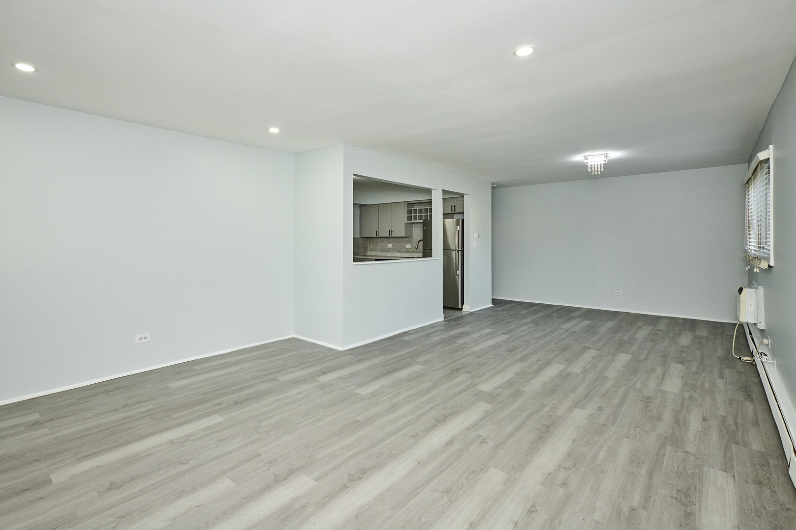 1320 Lore Lane, Unit 101A Lombard, IL 60148 - Photo 7 of 65 a view of empty room with wooden floor