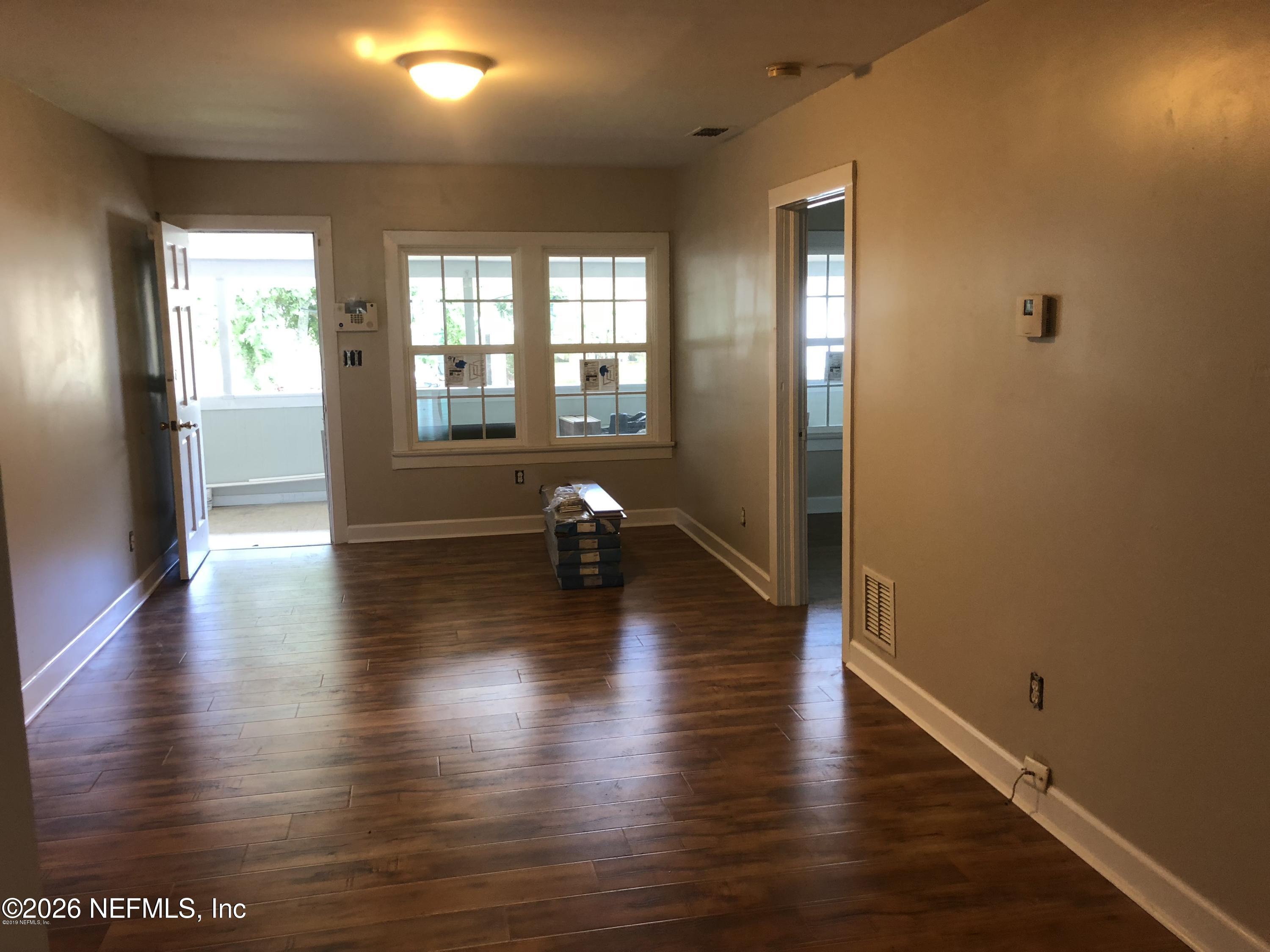 925 Phillips Street, Unit 3 Jacksonville, FL 32207 - Photo 4 of 10 a view of a room with wooden floor and a window