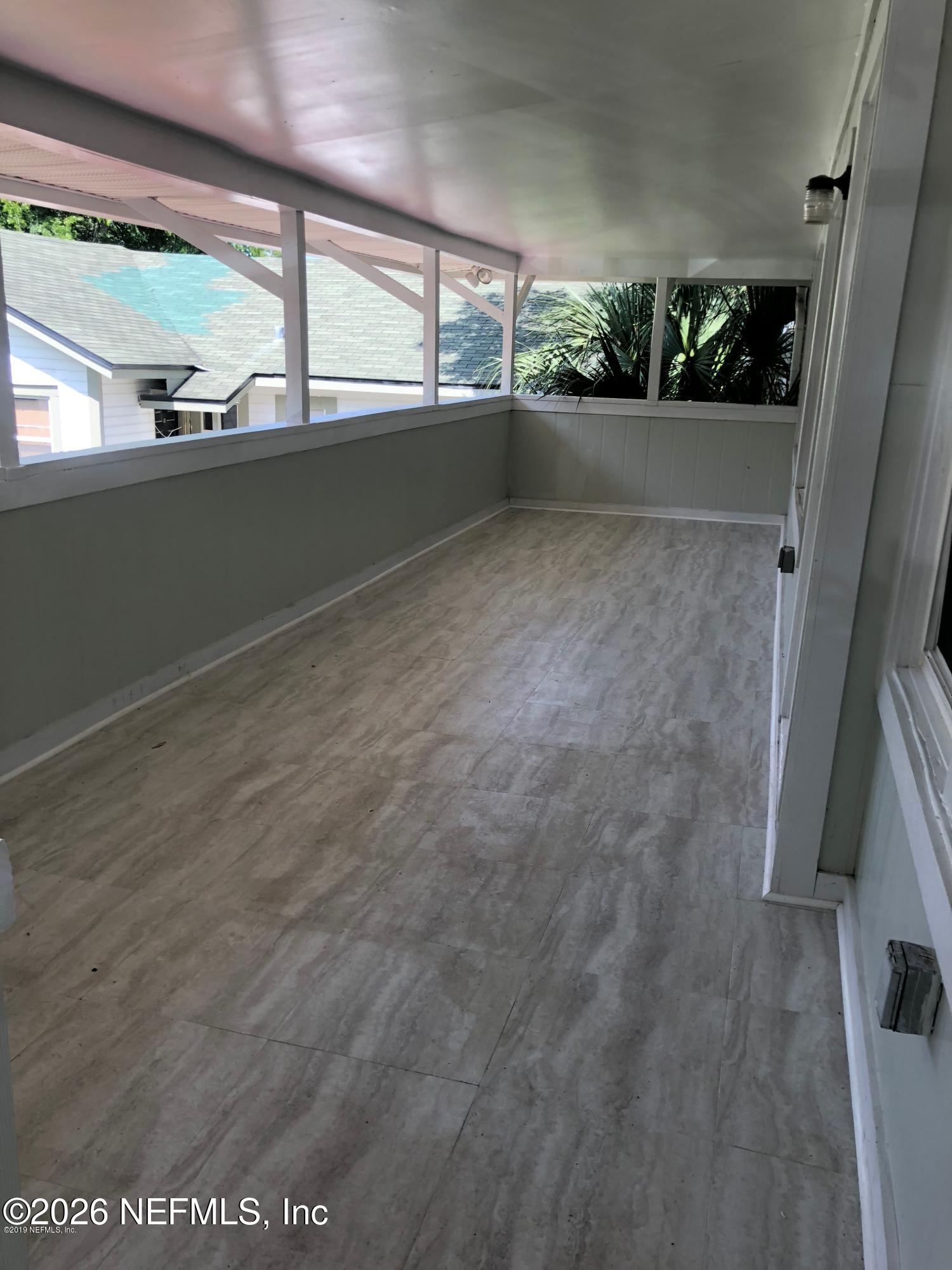 925 Phillips Street, Unit 3 Jacksonville, FL 32207 - Photo 10 of 10 a view of room with window and tree in it