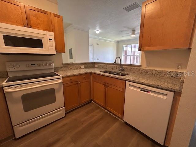8849 Villa View Circle, Unit 203 Orlando, FL 32821 - Photo 11 of 20 a kitchen with stainless steel appliances granite countertop a stove microwave and sink