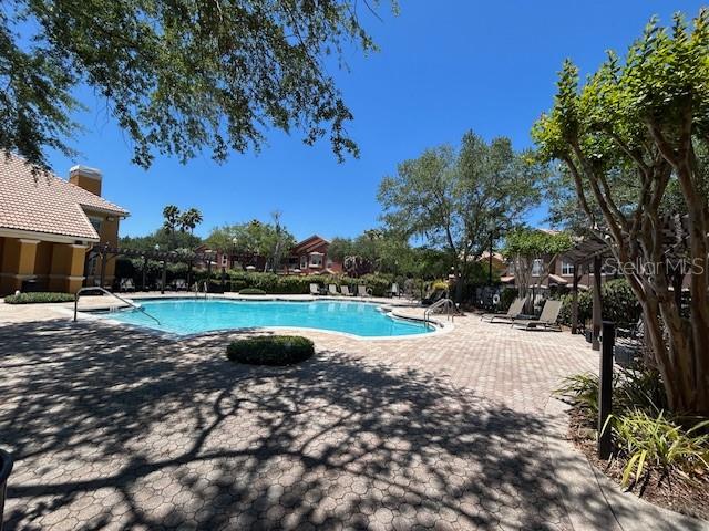 8849 Villa View Circle, Unit 203 Orlando, FL 32821 - Photo 18 of 20 a view of a lake with houses