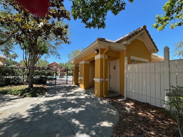 8849 Villa View Circle, Unit 203 Orlando, FL 32821 - Photo 19 of 20 a view of a house with a small yard