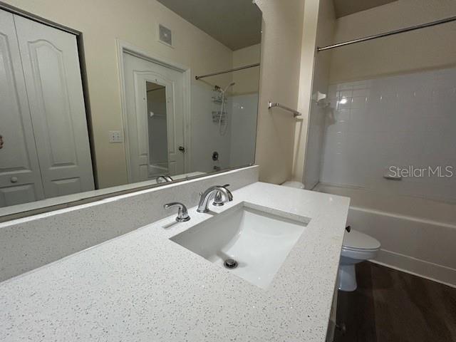 8849 Villa View Circle, Unit 203 Orlando, FL 32821 - Photo 7 of 20 a bathroom with a sink and a mirror
