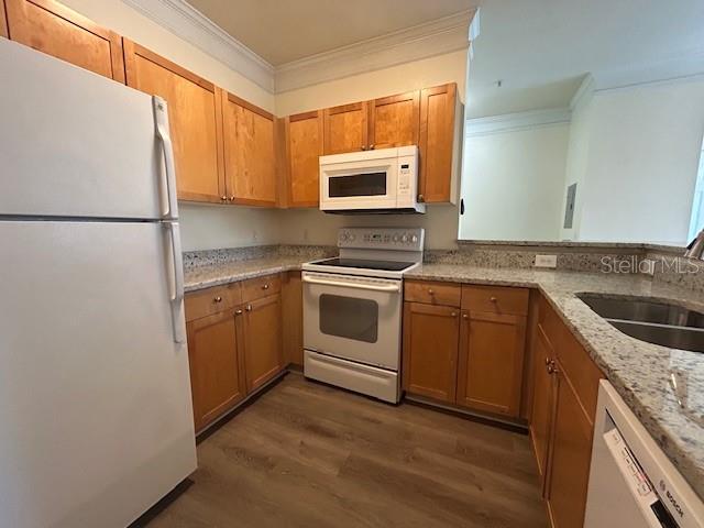 8849 Villa View Circle, Unit 203 Orlando, FL 32821 - Photo 8 of 20 a kitchen with a stove a sink and a refrigerator