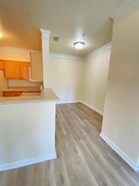 8849 Villa View Circle, Unit 203 Orlando, FL 32821 - Photo 9 of 20 a view of a room with wooden floor