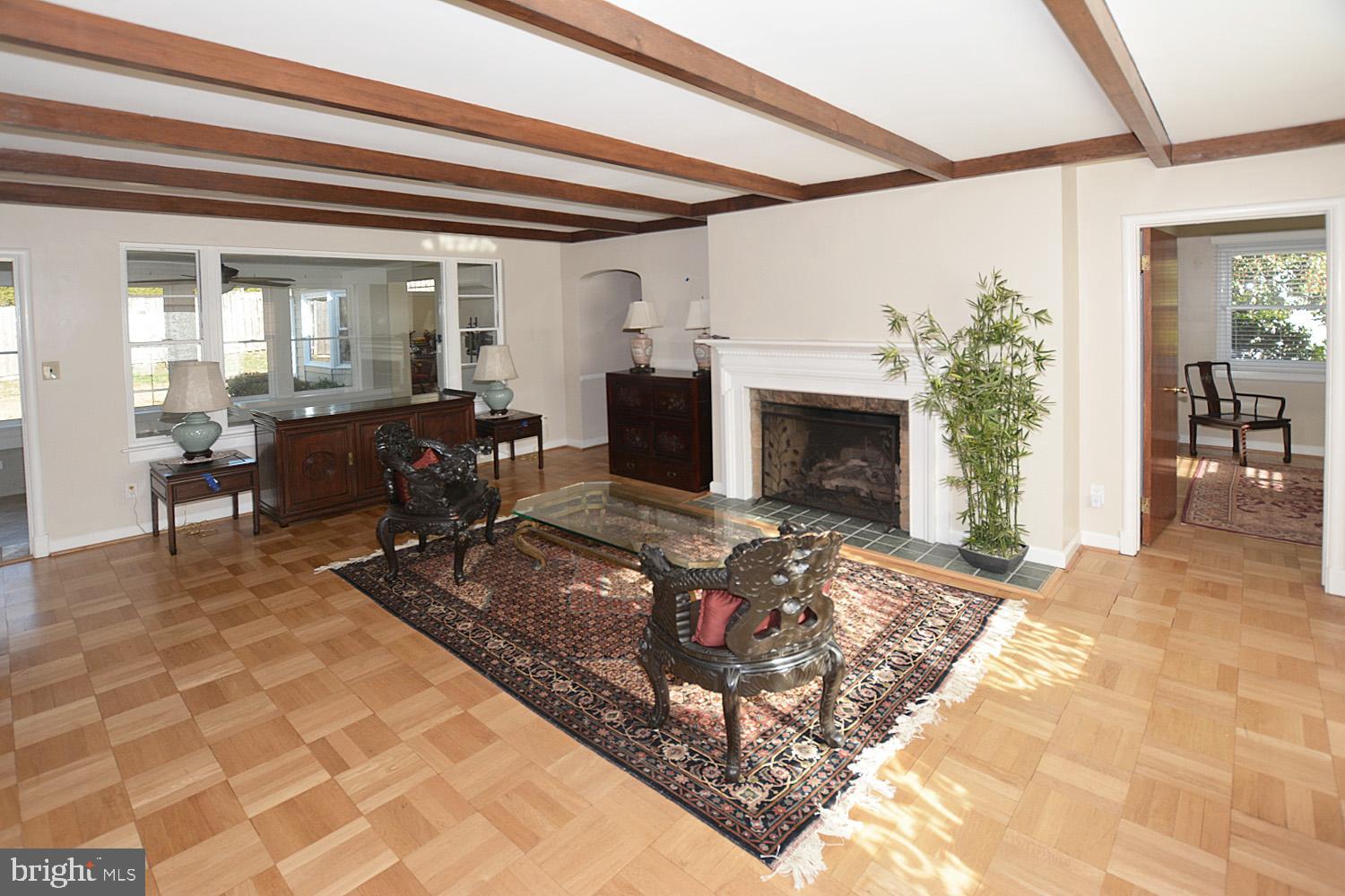 1515 23rd Road South Arlington, VA 22202 - Photo 8 of 34 LIVING ROOM OFFERING BEAMS, WOOD FLOOR & GAS FP