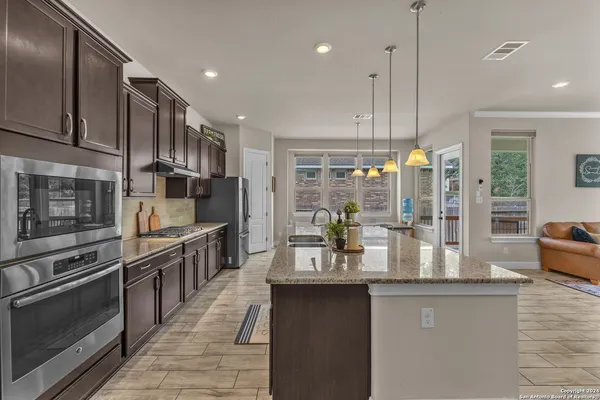 a kitchen with counter top space cabinets and stainless steel appliances