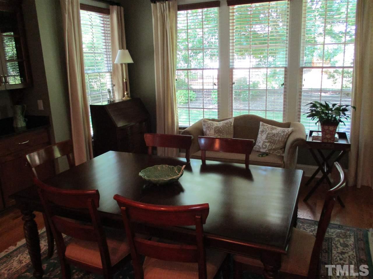 2513 Wertherson Lane Raleigh, NC 27613 - Photo 10 of 25 a living room with furniture and a floor to ceiling window
