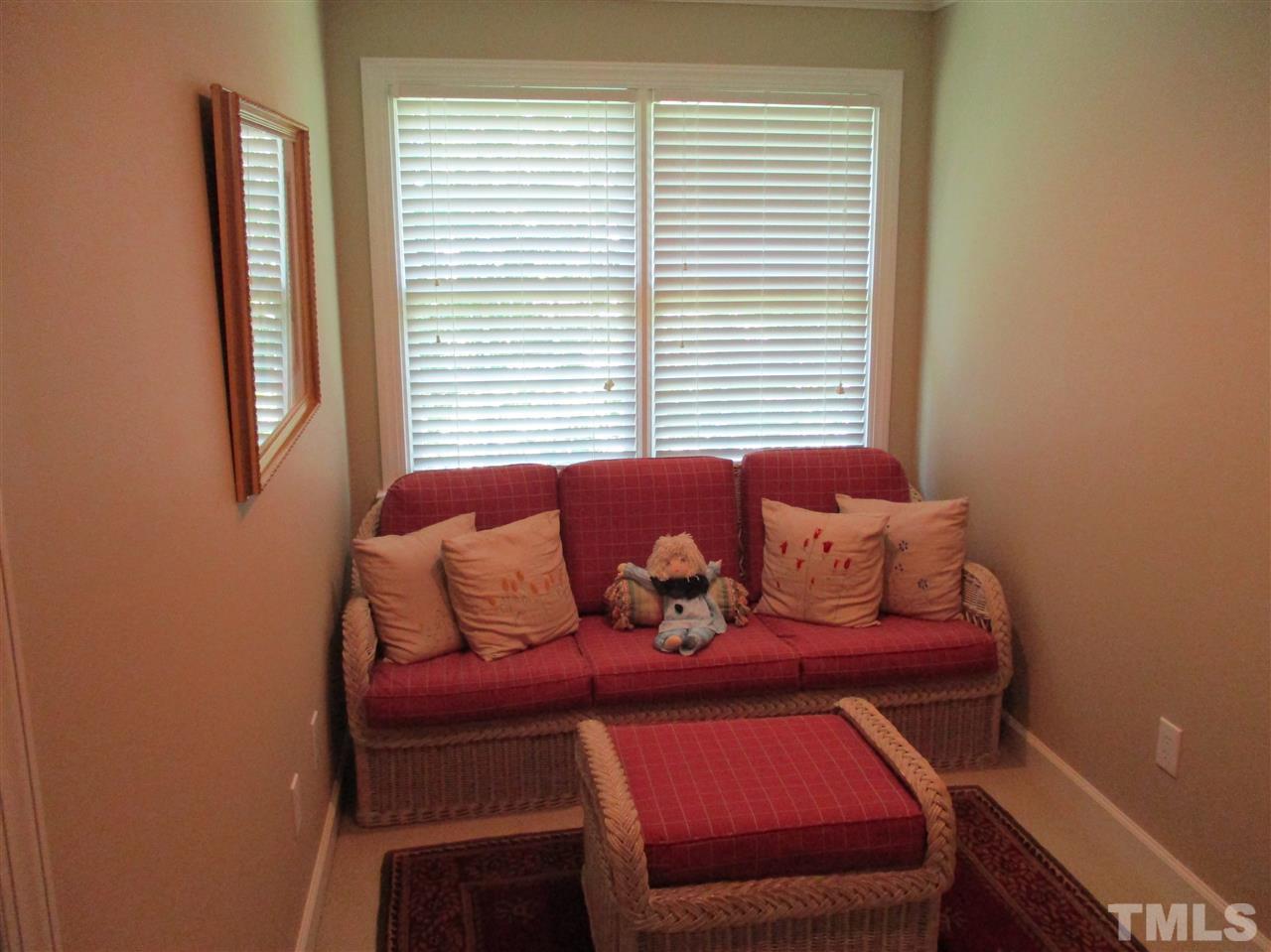 2513 Wertherson Lane Raleigh, NC 27613 - Photo 13 of 25 a living room with furniture and a window