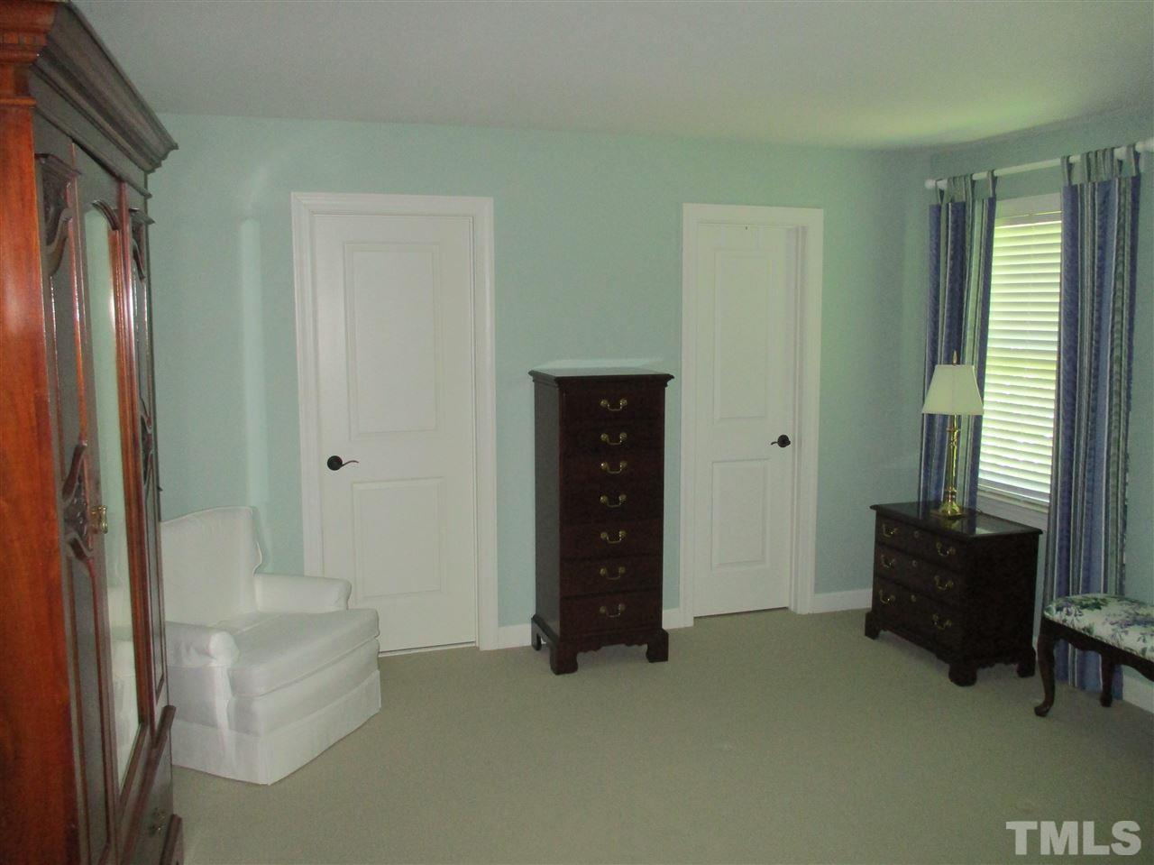 2513 Wertherson Lane Raleigh, NC 27613 - Photo 15 of 25 a living room with furniture and a fireplace