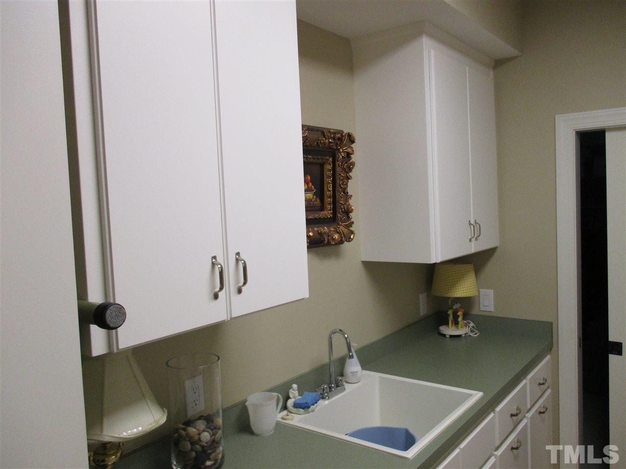 2513 Wertherson Lane Raleigh, NC 27613 - Photo 17 of 25 a bathroom with a sink and a mirror