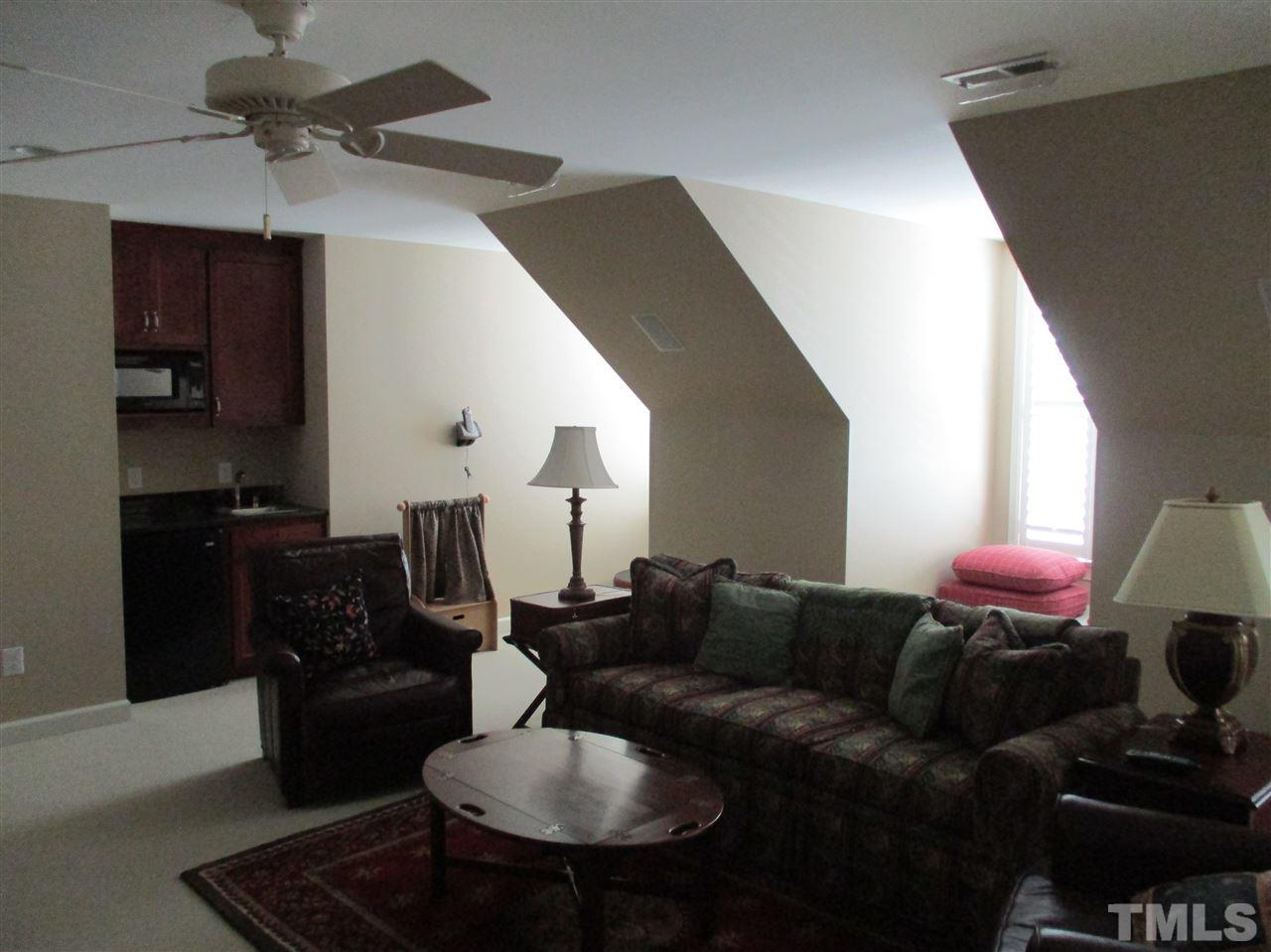 2513 Wertherson Lane Raleigh, NC 27613 - Photo 19 of 25 a living room with furniture and wooden floor