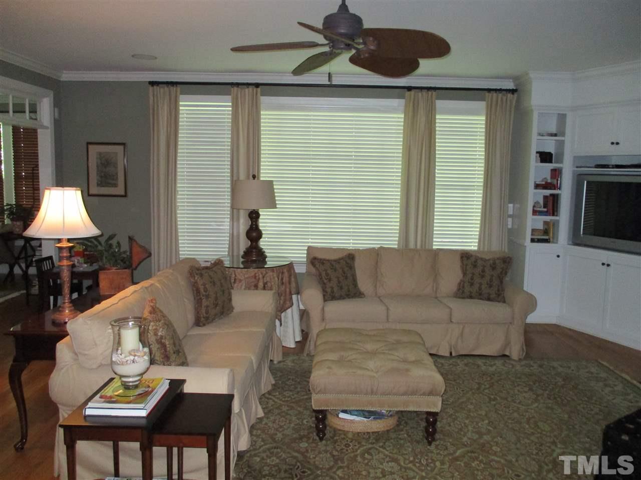 2513 Wertherson Lane Raleigh, NC 27613 - Photo 25 of 25 a living room with furniture and a flat screen tv