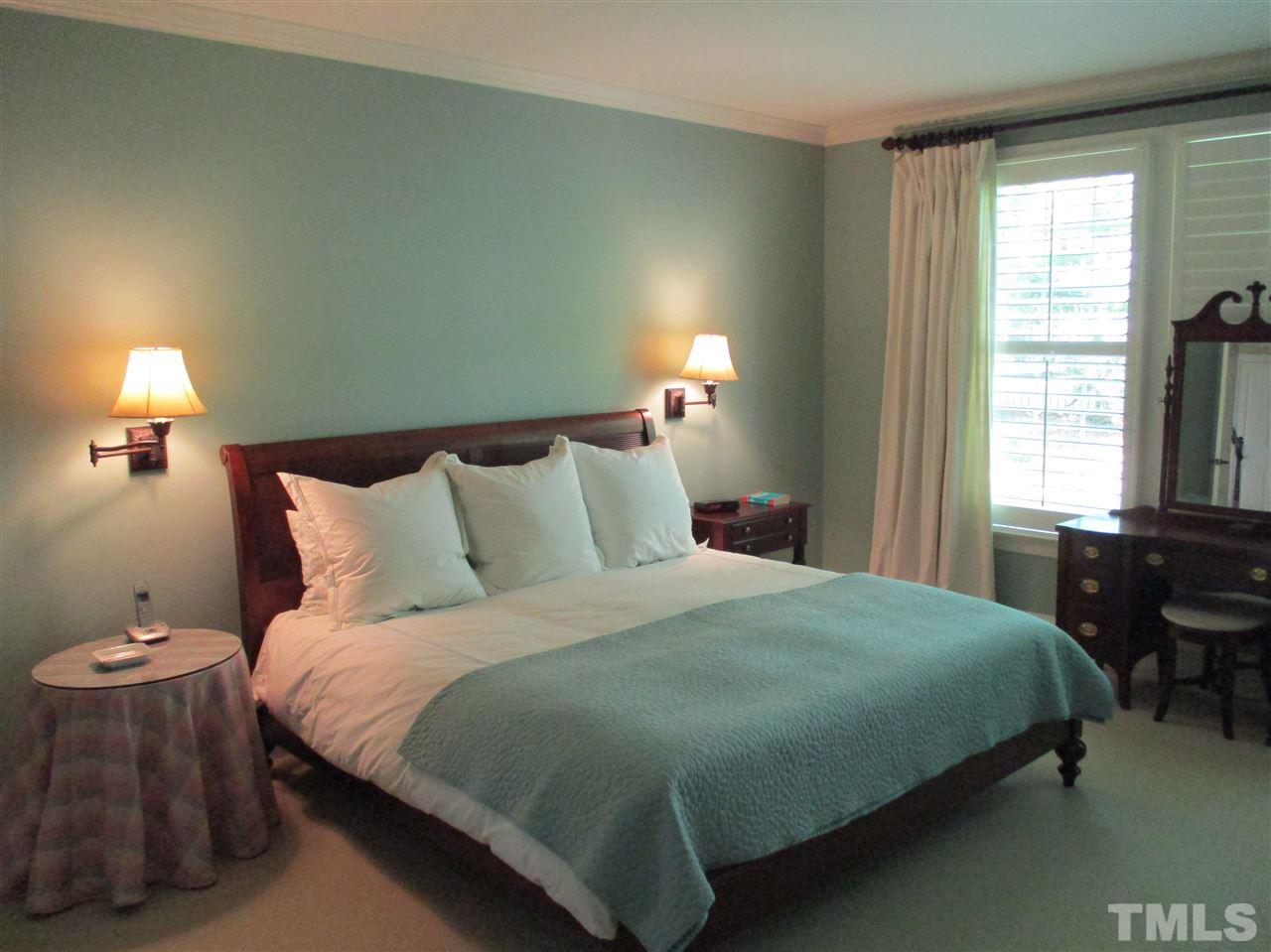 2513 Wertherson Lane Raleigh, NC 27613 - Photo 20 of 25 a bedroom with a bed and window