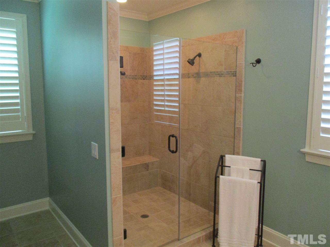 2513 Wertherson Lane Raleigh, NC 27613 - Photo 22 of 25 a bathroom with a shower and toilet