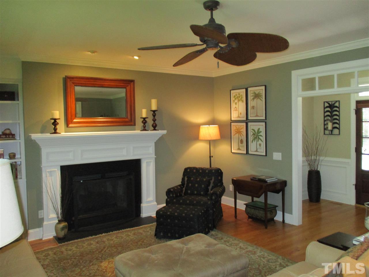 2513 Wertherson Lane Raleigh, NC 27613 - Photo 3 of 25 a living room with furniture and a fireplace