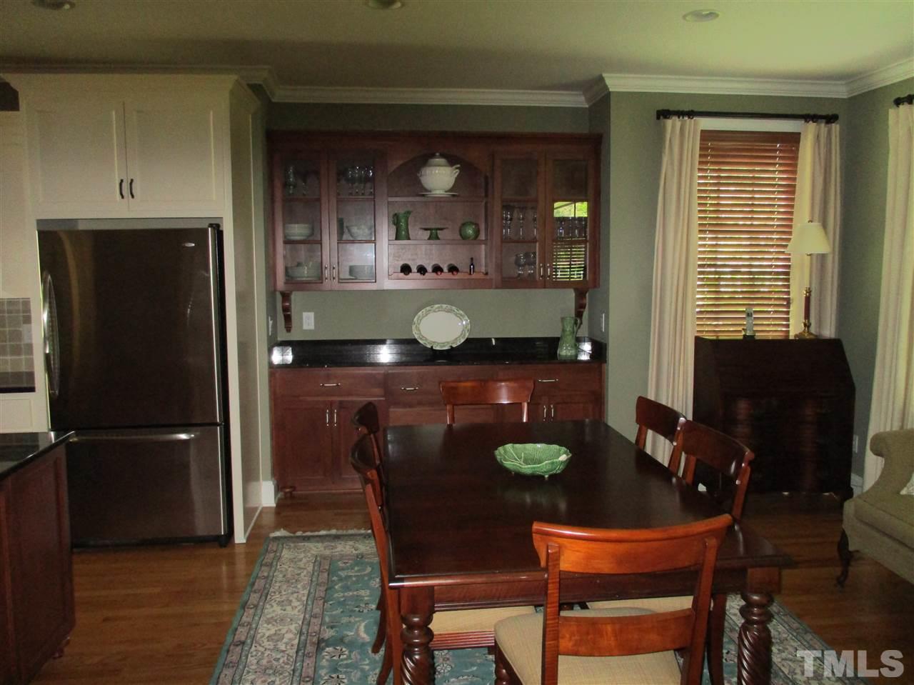 2513 Wertherson Lane Raleigh, NC 27613 - Photo 9 of 25 a dining room with a table and chairs