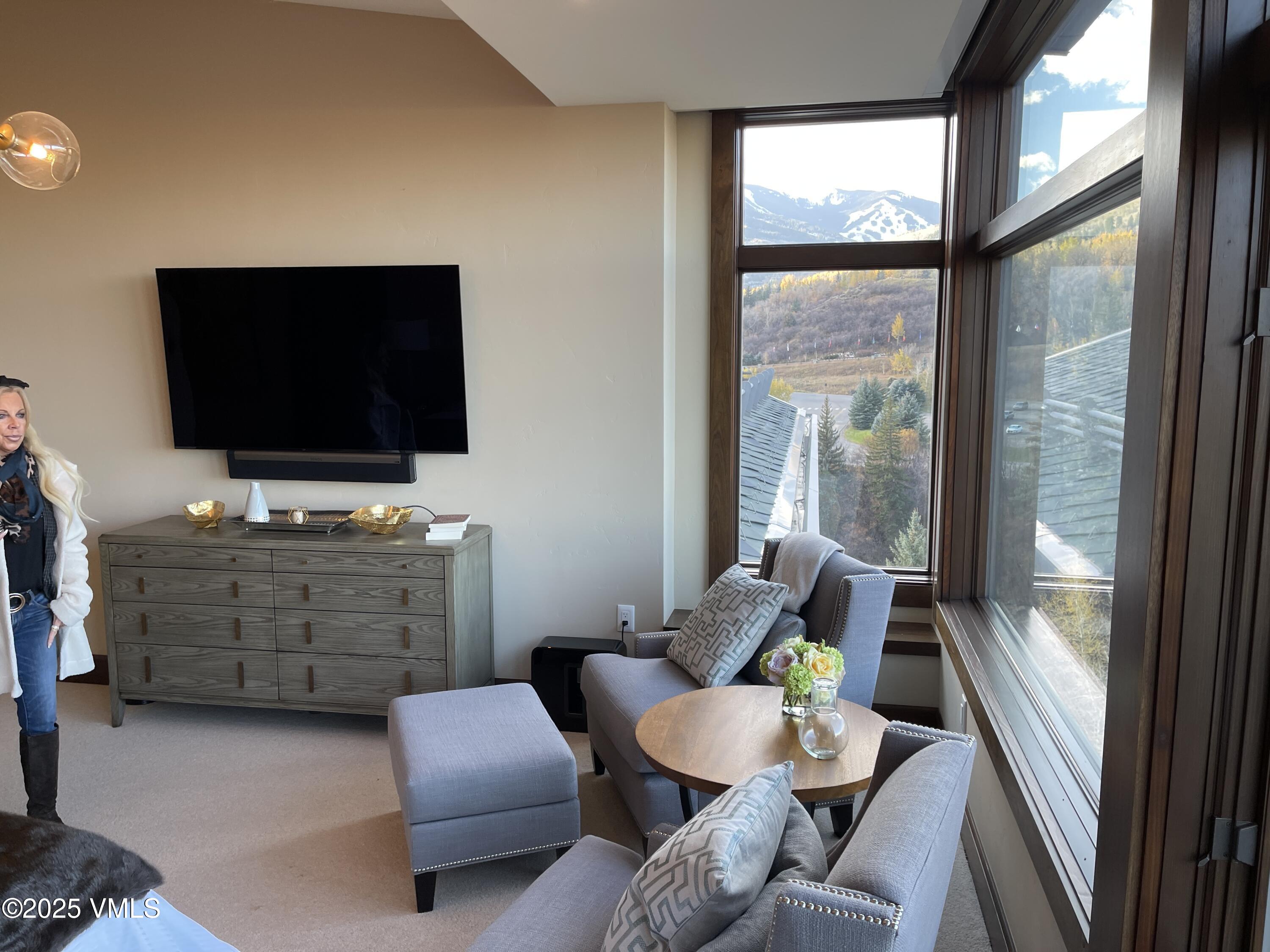 126 Riverfront Lane, Unit 510 Avon, CO 81620 - Photo 19 of 54 a living room with furniture and a flat screen tv