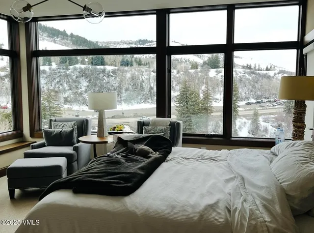 a view of kitchen cabinets and window