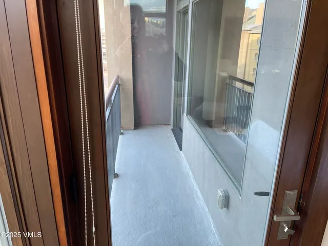 a bedroom with bed and a flat screen tv