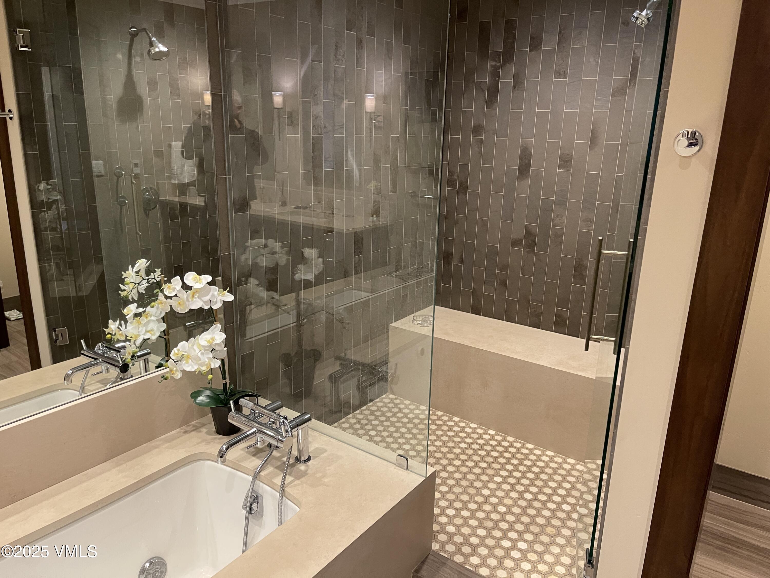 126 Riverfront Lane, Unit 510 Avon, CO 81620 - Photo 31 of 54 a bathroom with a sink and a shower