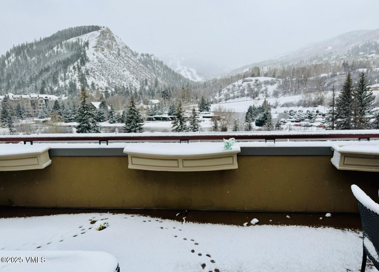 126 Riverfront Lane, Unit 510 Avon, CO 81620 - Photo 39 of 54 a view of a lake with a building in the background