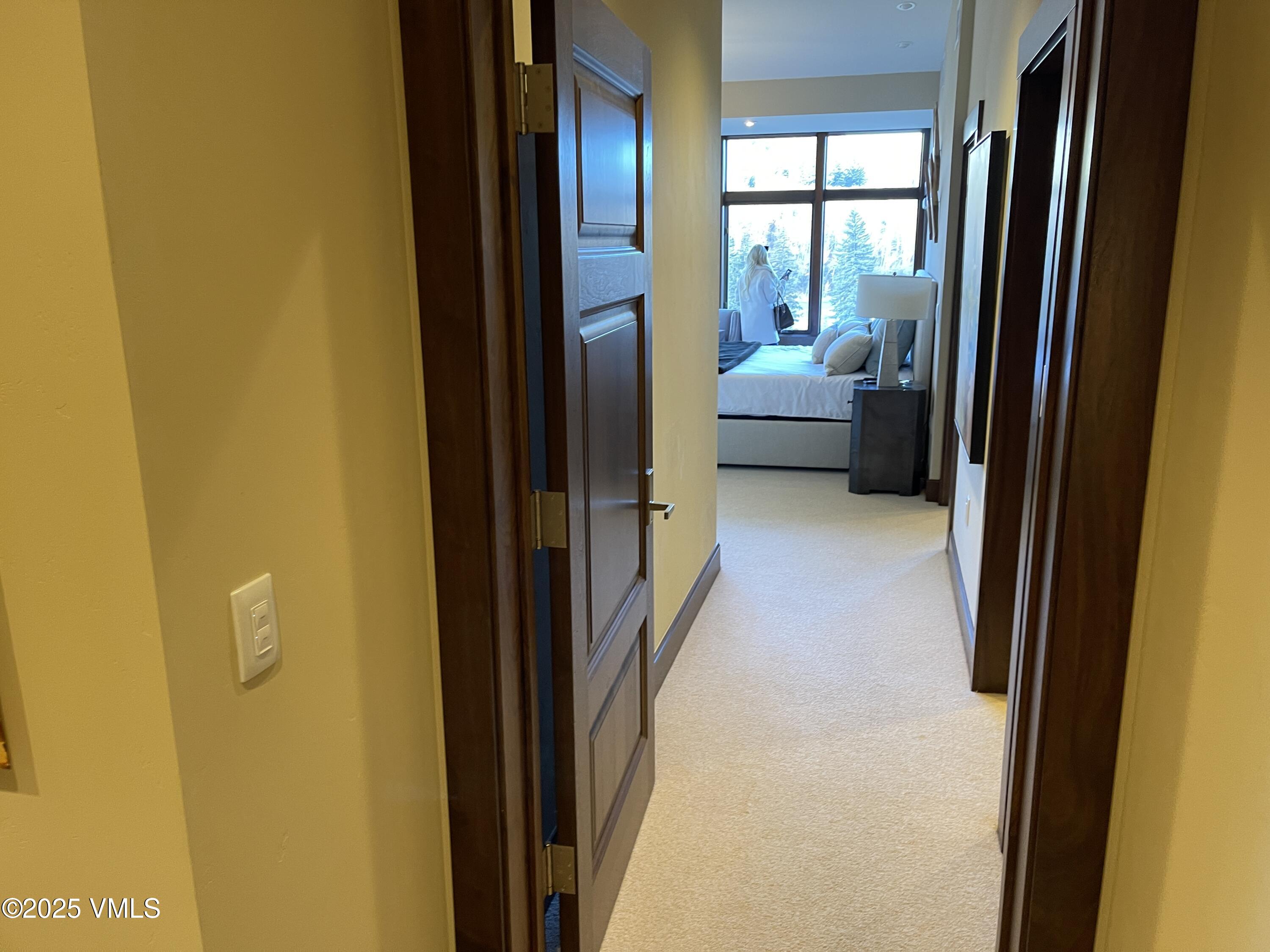 126 Riverfront Lane, Unit 510 Avon, CO 81620 - Photo 46 of 54 a view of a hallway with furniture and front door