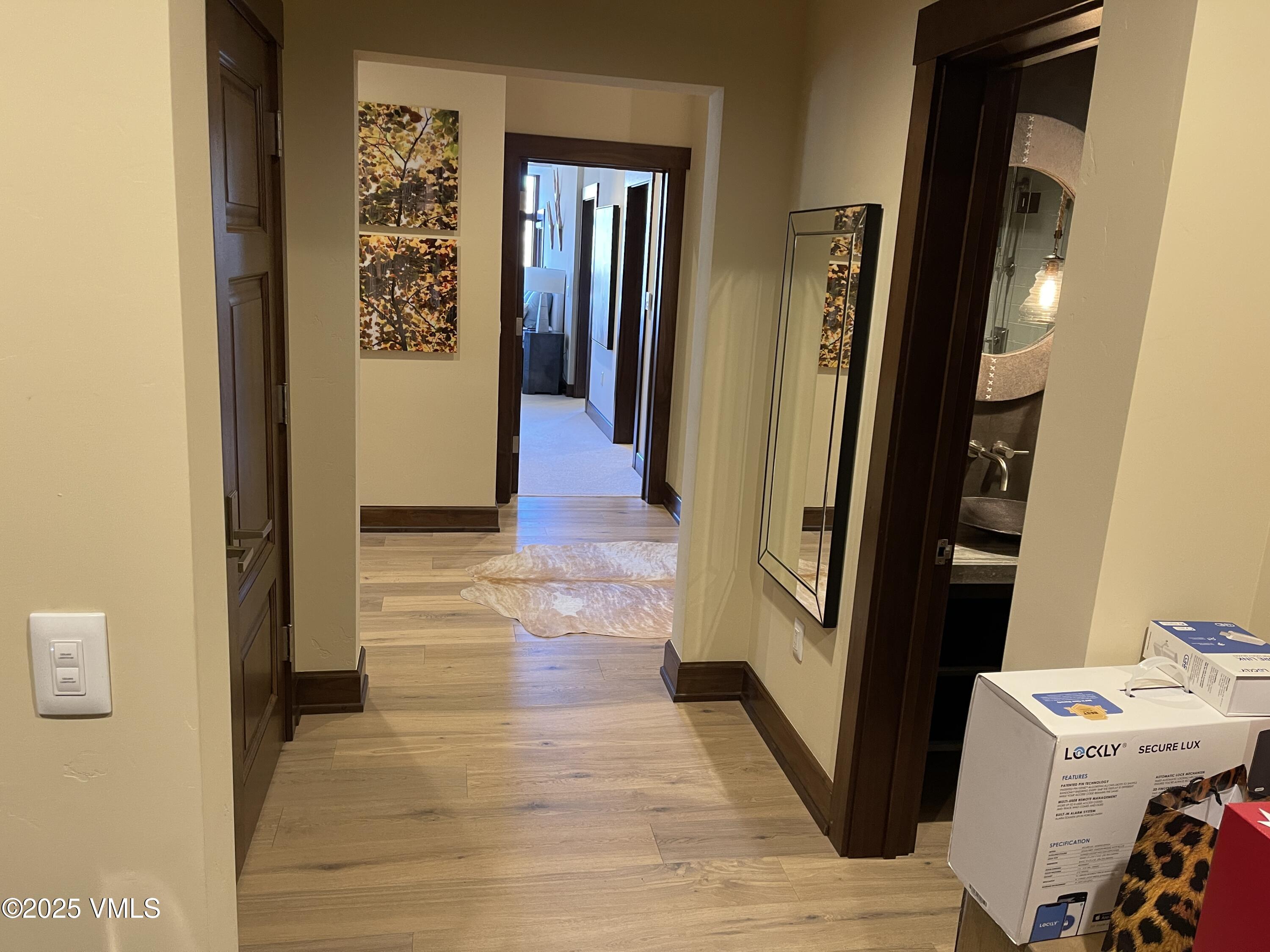 126 Riverfront Lane, Unit 510 Avon, CO 81620 - Photo 52 of 54 a view of a hallway with wooden floor