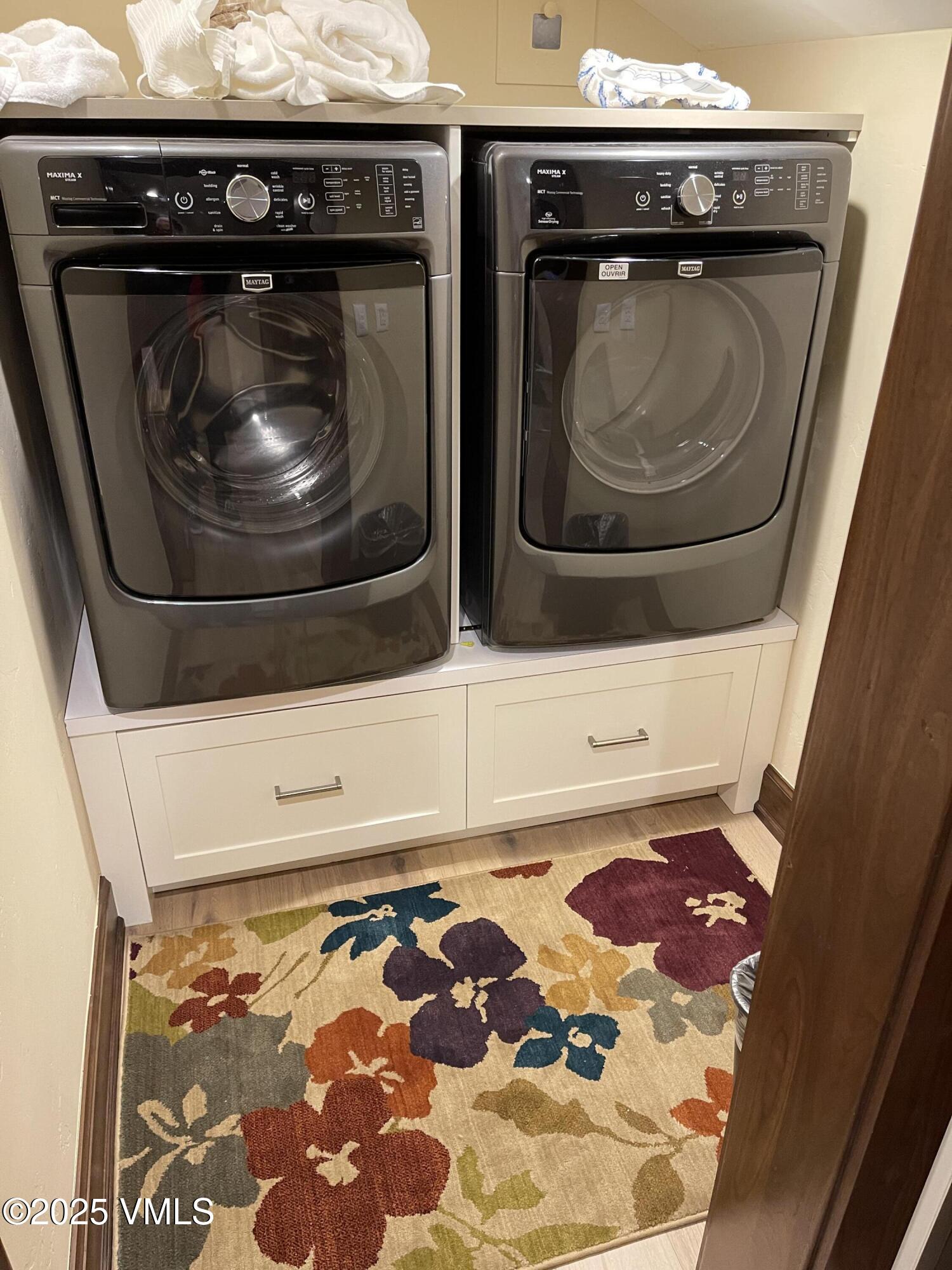 126 Riverfront Lane, Unit 510 Avon, CO 81620 - Photo 54 of 54 a utility room with dryer and washer
