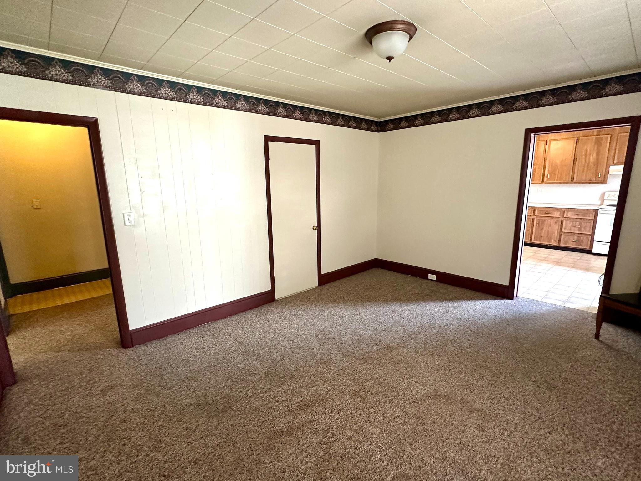 4576 Lemar Road, Unit 3 Mercersburg, PA 17236 - Photo 11 of 15 a view of empty room with wooden floor and fan