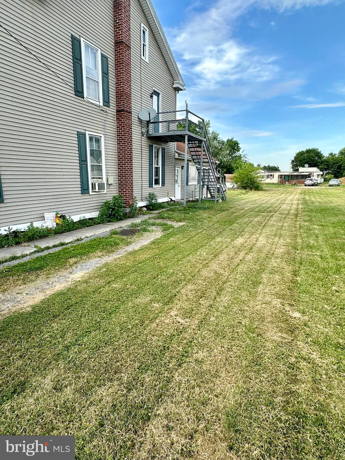 4576 Lemar Road, Unit 3 Mercersburg, PA 17236 - Photo 3 of 15 a view of a house with a yard and sitting area